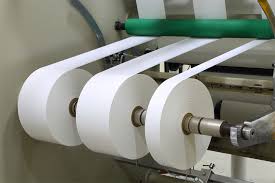 Printed label rolls on production line